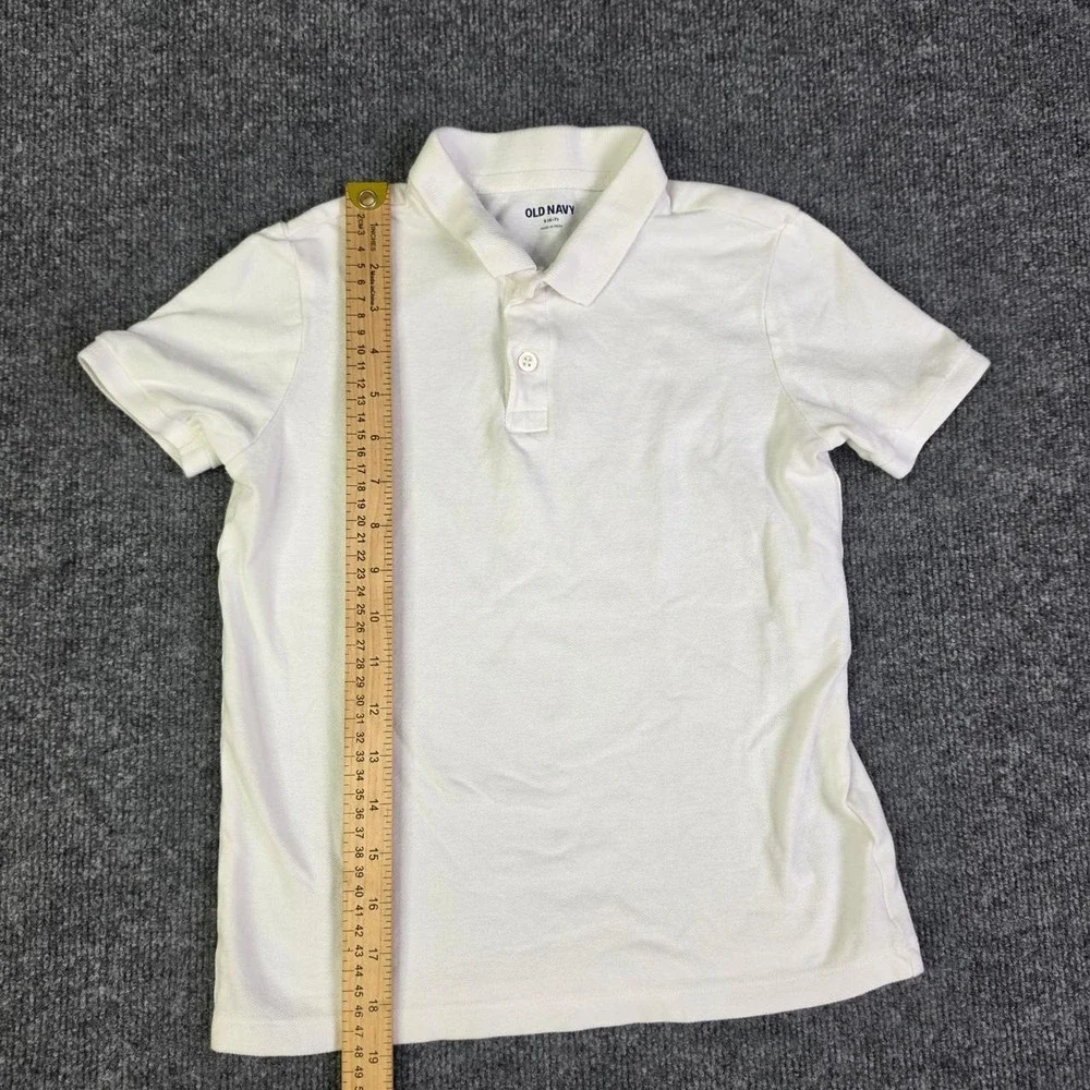 Kids Old Navy white polo shirt in size S (6-7)